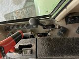 a close up of a car dashboard with a wrench on it