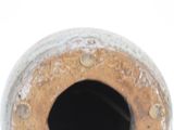 a close up view of a vase with a hole in it