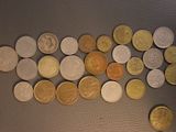 a lot of coins that are on the table