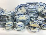 a lot of blue and white plates and bowls