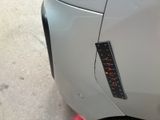 a close up of a car with a sticker on the side of it