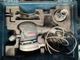 a tool in a plastic case with wires and wires