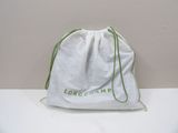 a close up of a bag on a table with a white background