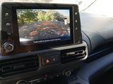a car dashboard with a monitor in the middle of it