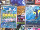 many different types of pokemon cards on the table
