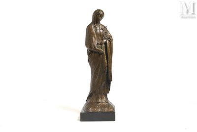 bronze statue of a woman holding a rosary