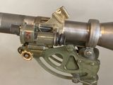 a close up of a machine gun on a stand