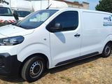 a white van that is parked in the grass