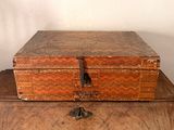 an old wooden box sitting on top of a wooden table