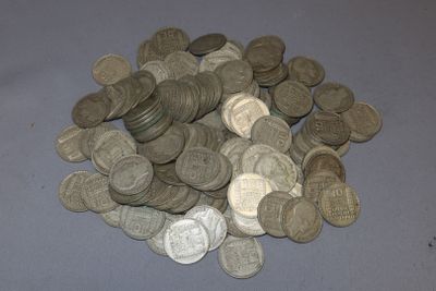 a pile of silver coins sitting on a table