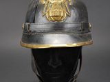 an old helmet with a coat of arms on top of it
