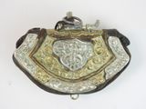 an image of a silver and gold purse on a white surface