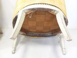 a chair that has a yellow and white checkered cover on it