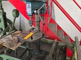 a machine that is working on a piece of wood