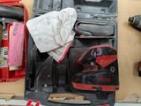a tool box with tools and a pair of shoes in it