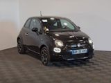 a picture of a small black car in a showroom
