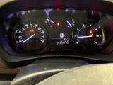 a close up of a car dashboard with various gauges