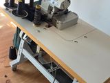 a sewing machine sitting on a table in a room