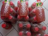many bottles of water sitting on the floor next to each other