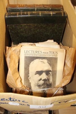 a box full of old books with a picture of a man in it