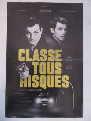 une affiche de film représentant deux hommes armés devant une voiture
