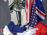 a pile of american and british flags on a table