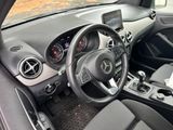 the interior of a car with a steering wheel, dashboard, and dashboard controls