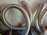 two hoses sitting next to each other in a room