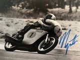 a man that is riding a motorcycle on the road