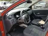 a red car with black seats and a steering wheel