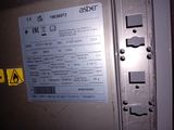 a close up of a metal door with a label on it