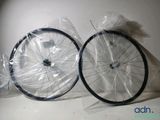 two wheels that are wrapped in plastic on the table
