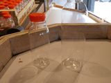 two empty glasses sitting on a table in front of a window