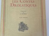 an old book with a picture of a man sitting in a chair