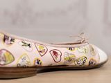 the shoes are on a wooden table with a white background