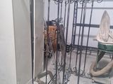 a metal gate that has a bunch of tools in it