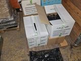 several boxes of assorted items sitting on a floor in a room