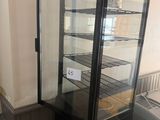 an image of a refrigerator with a glass door