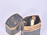 a small box with a ring inside of it
