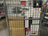 a large metal cage with a bunch of boxes on top of it