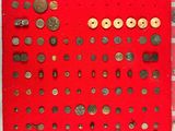 a close up of a red board with lots of buttons on it