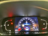 the dashboard of a car with a digital display on it