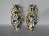 two vases that have been decorated with flowers on them