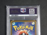 the pokemon card is in a clear plastic holder on a table