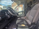 a seat in the back of a van with a bag on it