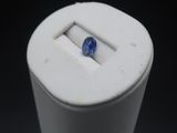 an image of a blue sapphire in a white container
