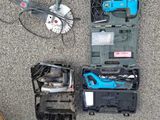 a box of tools sitting on the floor next to a box of tools