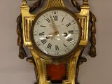 a clock hanging on the wall in a room