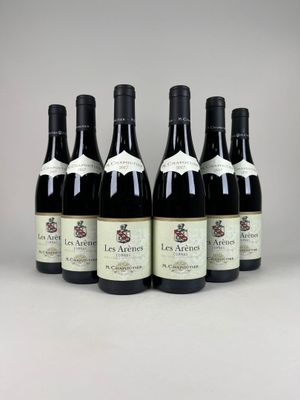 six bottles of wine are lined up in a row