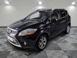 the 2013 ford escape is parked in the garage